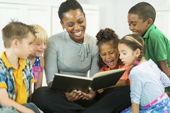 teacher reading to small group of students