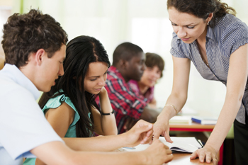 teacher helping students